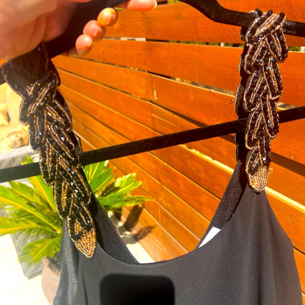 Beautiful black mini dress with beaded straps. Size S.